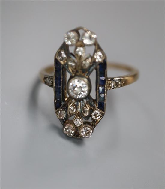 A 1920s? Austrian pierced yellow metal, diamond and sapphire set upfinger dress ring, size Q, gross 4.1 grams,